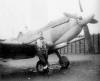 Flying Officer Max Collett beside his Spitfire IXB