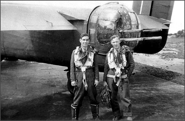 Harold Edwards and Rolland Wallace by the rear turret of BM-B 'Beer Is Best'.