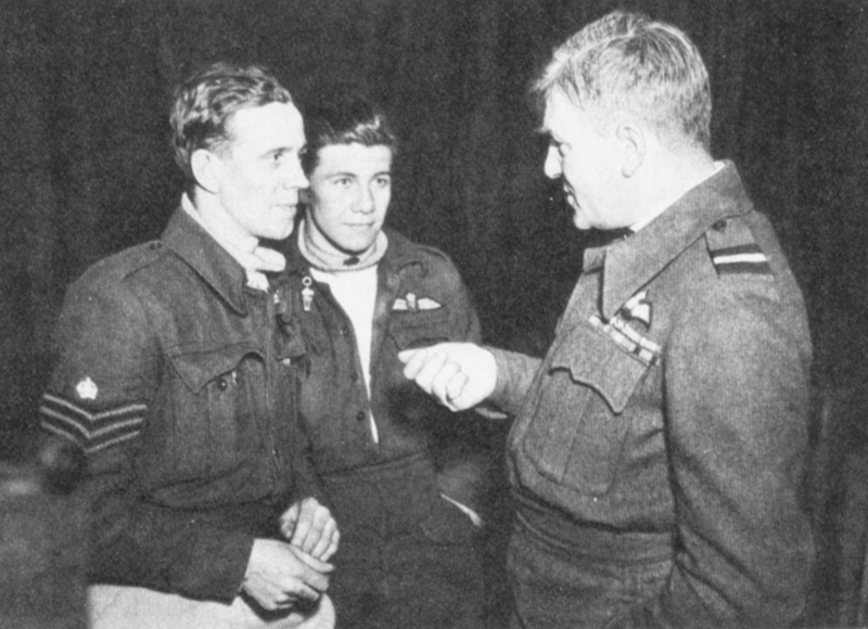 Air Commodore Arthur Wray talking to Douglas Sutton and his navigator