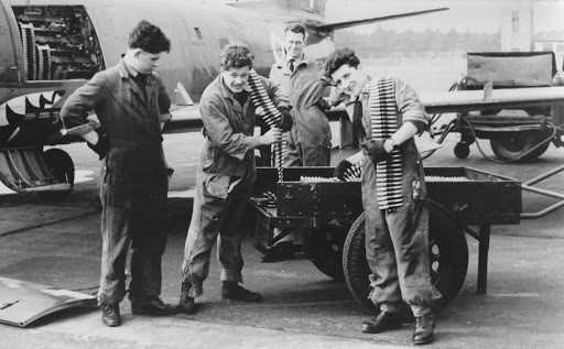 Armourers of No 112 Sqn re-arming a Sabre